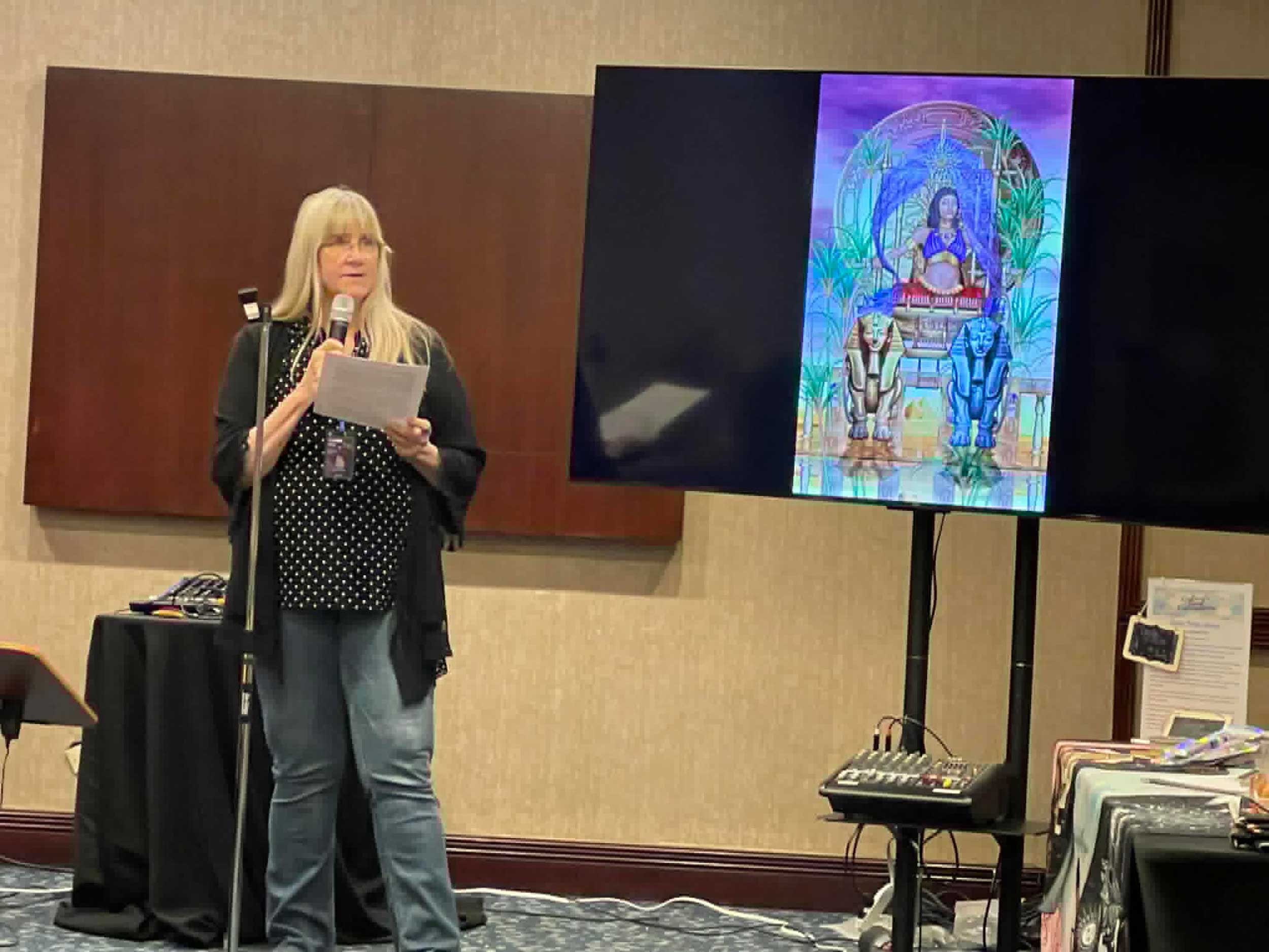 Mary Ellen Collins telling a tarot story in the Bardic Circle at StaarCon 2024.